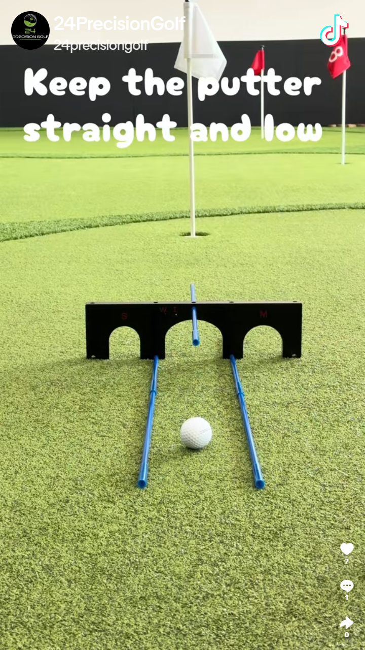 Putting ball between alignment rods for Eric Brasch's straight-and-low putter drill
